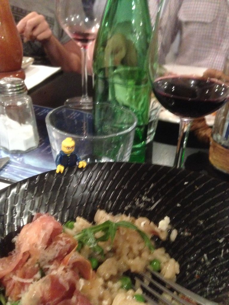 White wine risotto with prosciutto, lemon zest, feta cheese, roquette and green peas