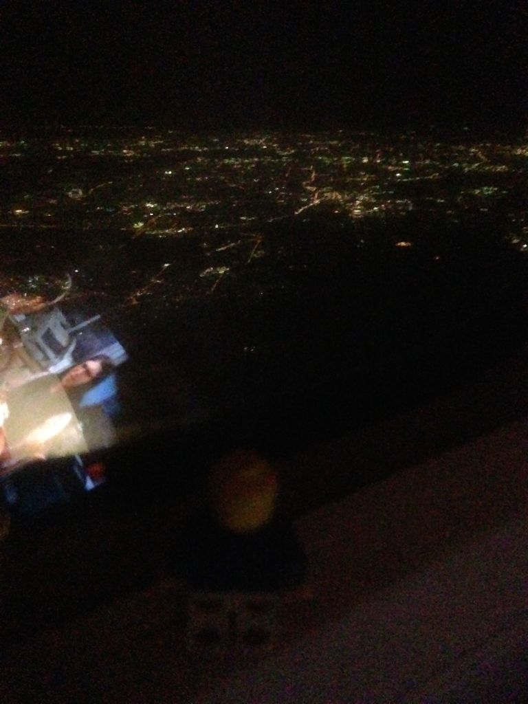 Sydney (with the reflection of the iPad app playing an episode of "Big Bang Theory" on the left)